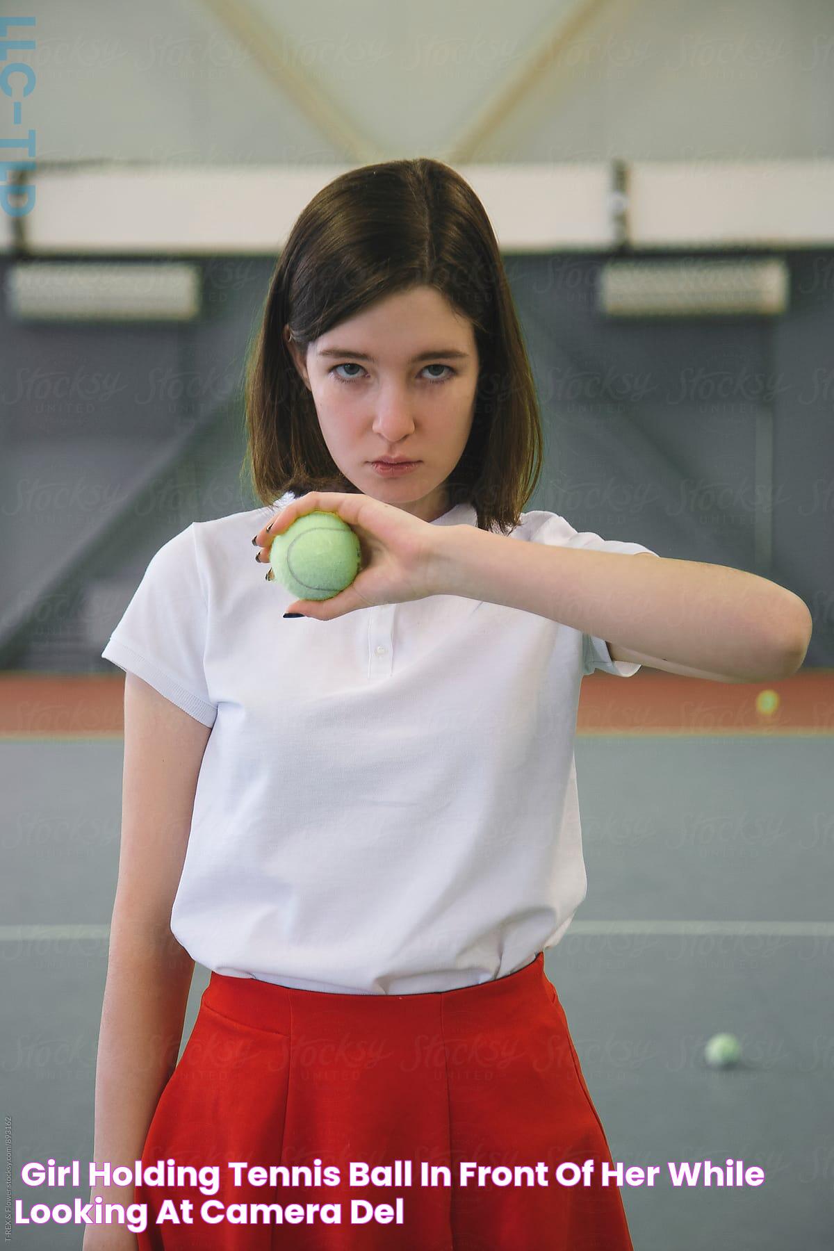 «Girl Holding Tennis Ball In Front Of Her While Looking At Camera» del